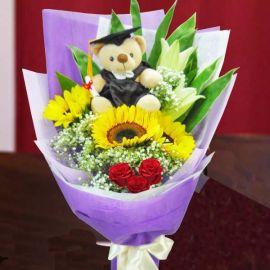 Graduate Bear 15cm With 3 SunFlowers, 2 Lilies & 3 Red Roses Hand Bouquet