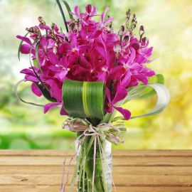 Purple Orchids in Glass Vase
